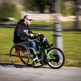 Man in a Wheelchair assist device