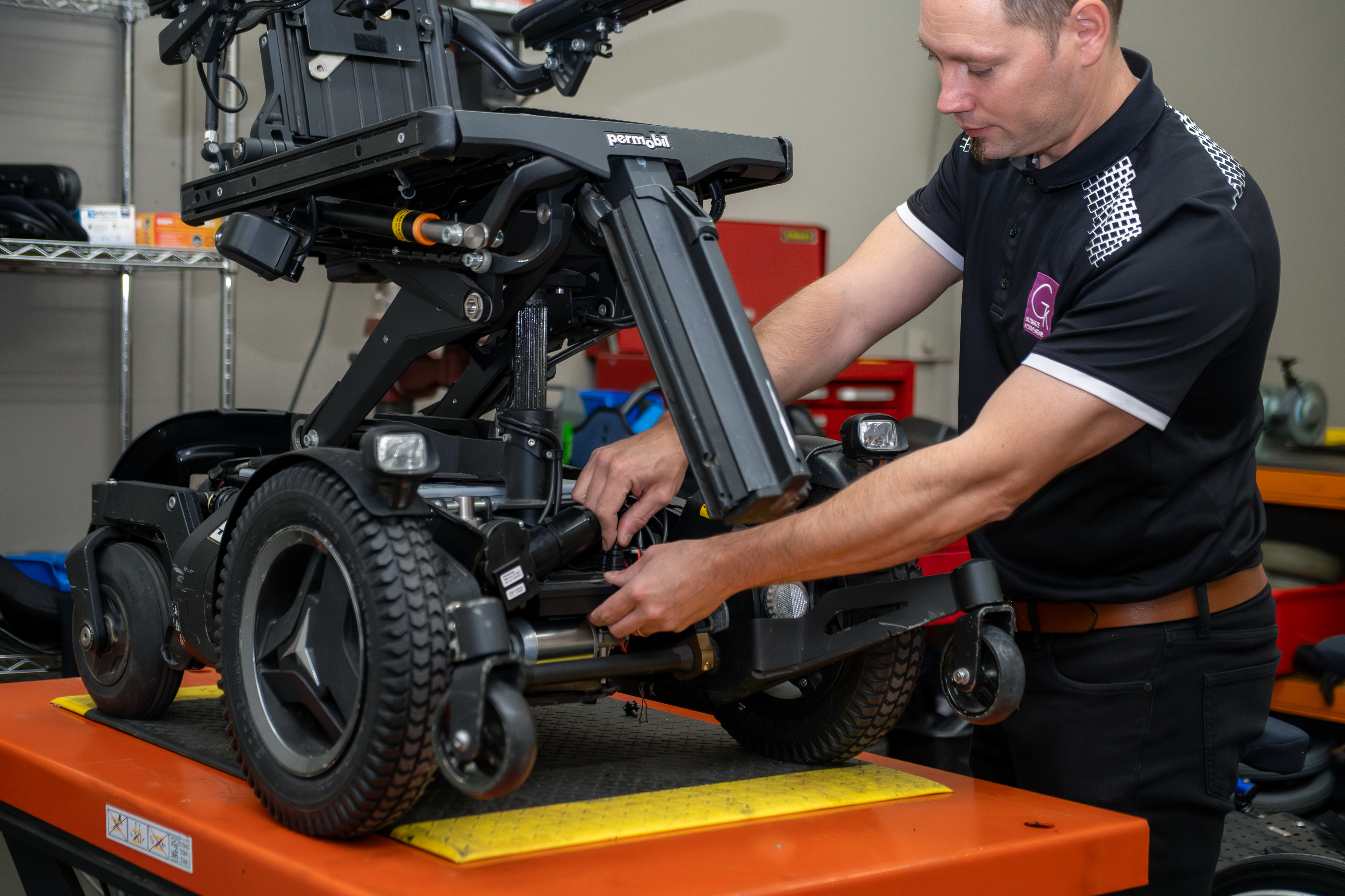 Service technician working on wheelchair