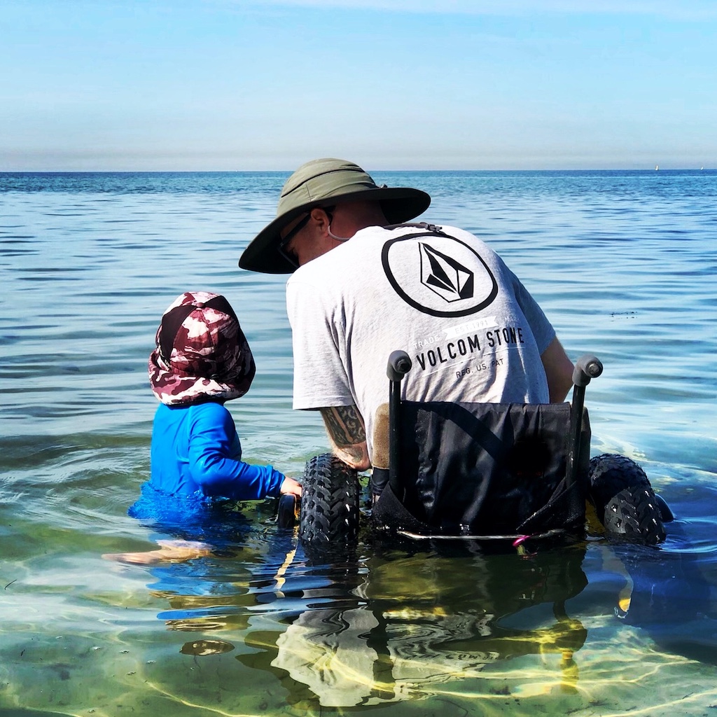 Dad in wheelchair with his kid