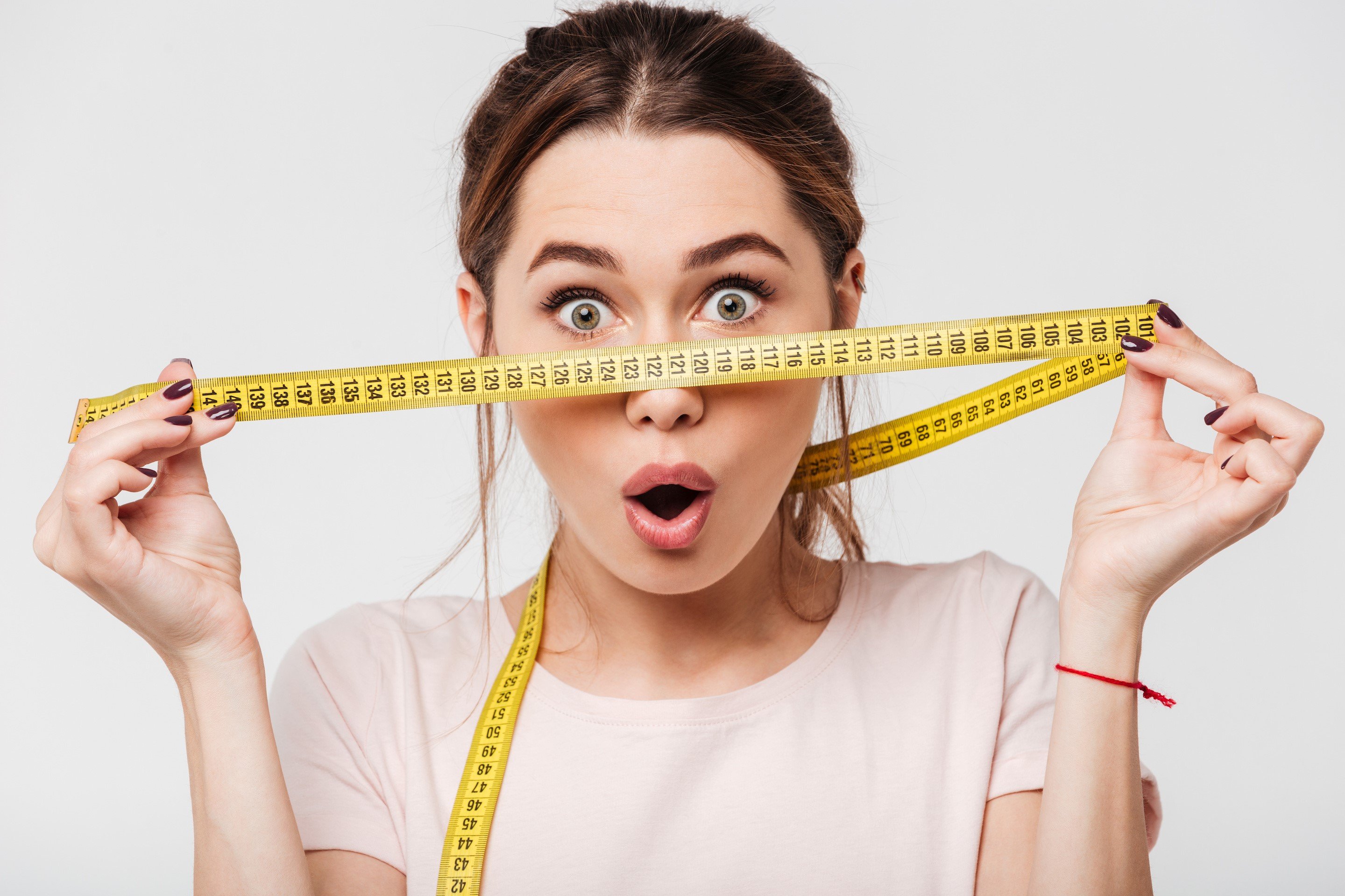 Women holding a measuring tape