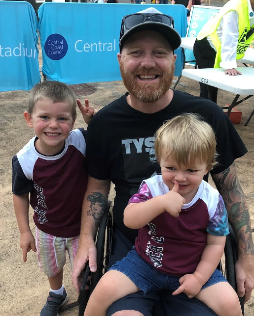 Dad in wheelchair with his sons