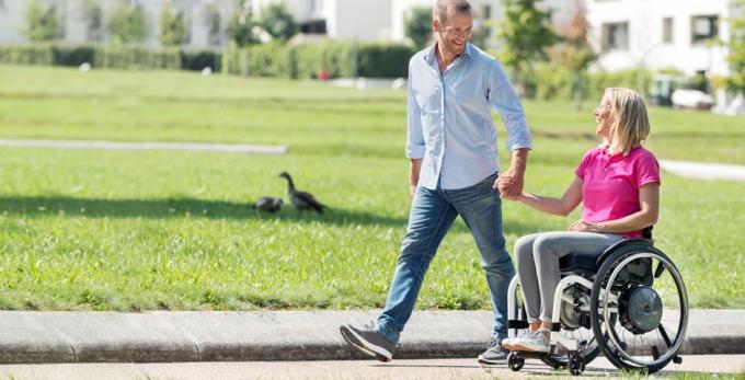 Man and woman in a wheelchair