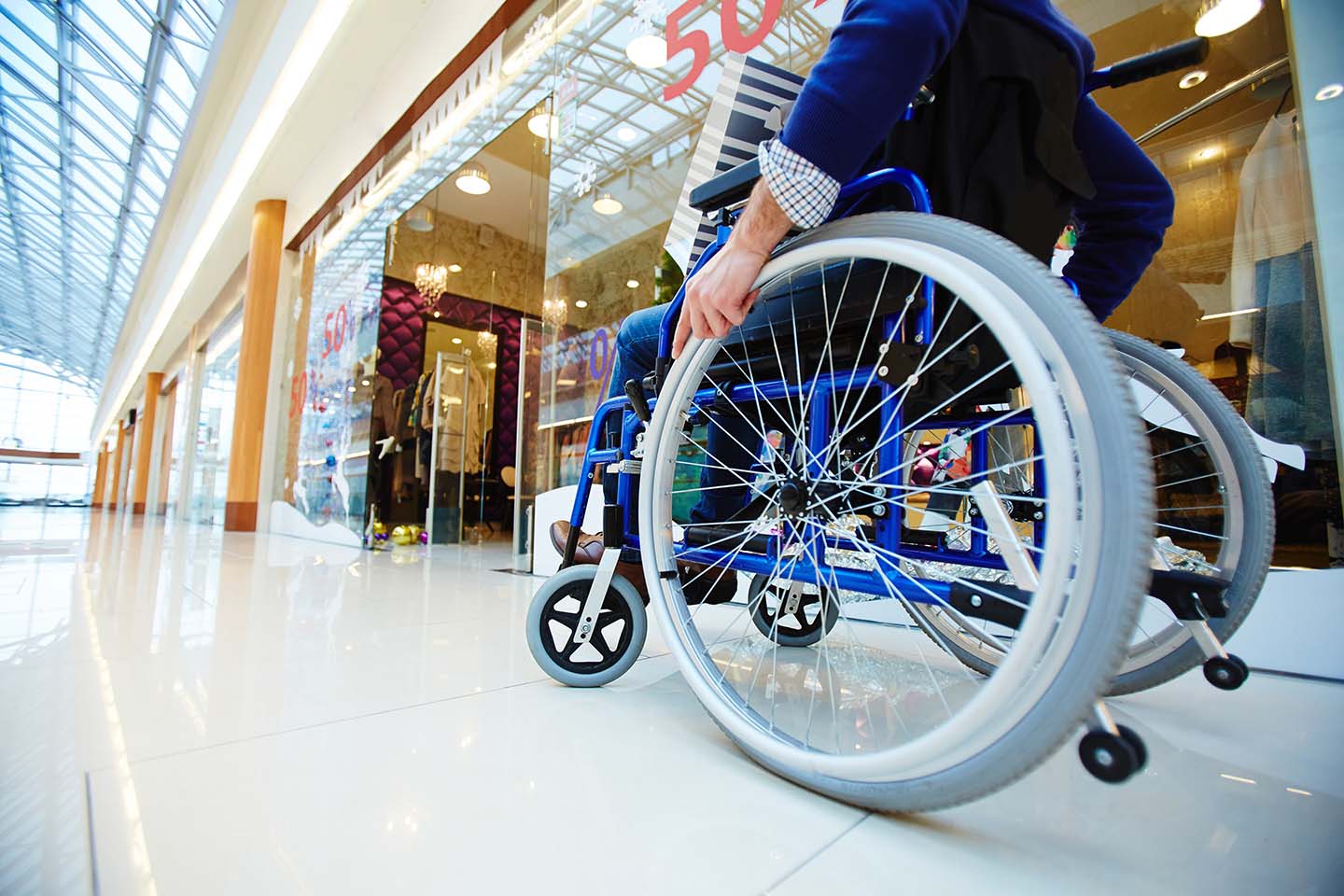 Man in a wheelchair in a shopping center